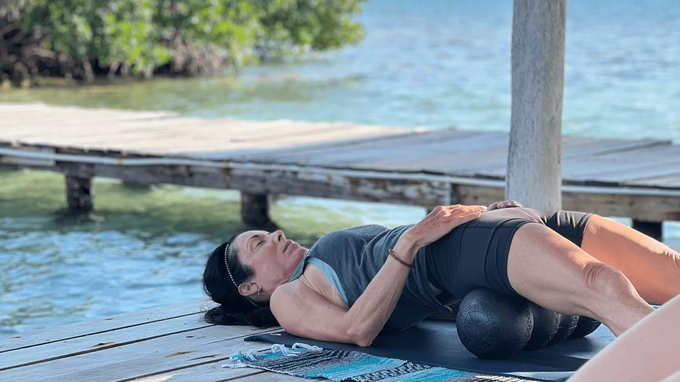 woman relaxing at pilates retreat in belize